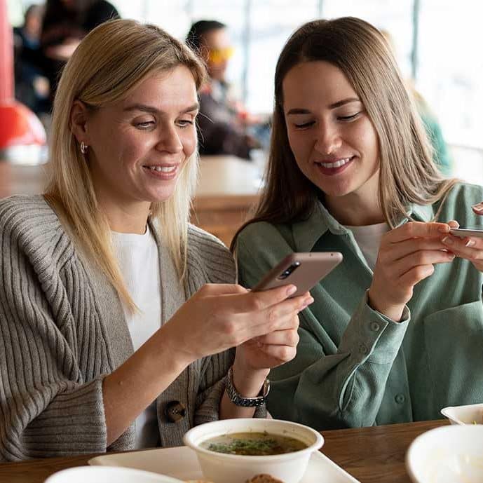 Girls looking at a phone
